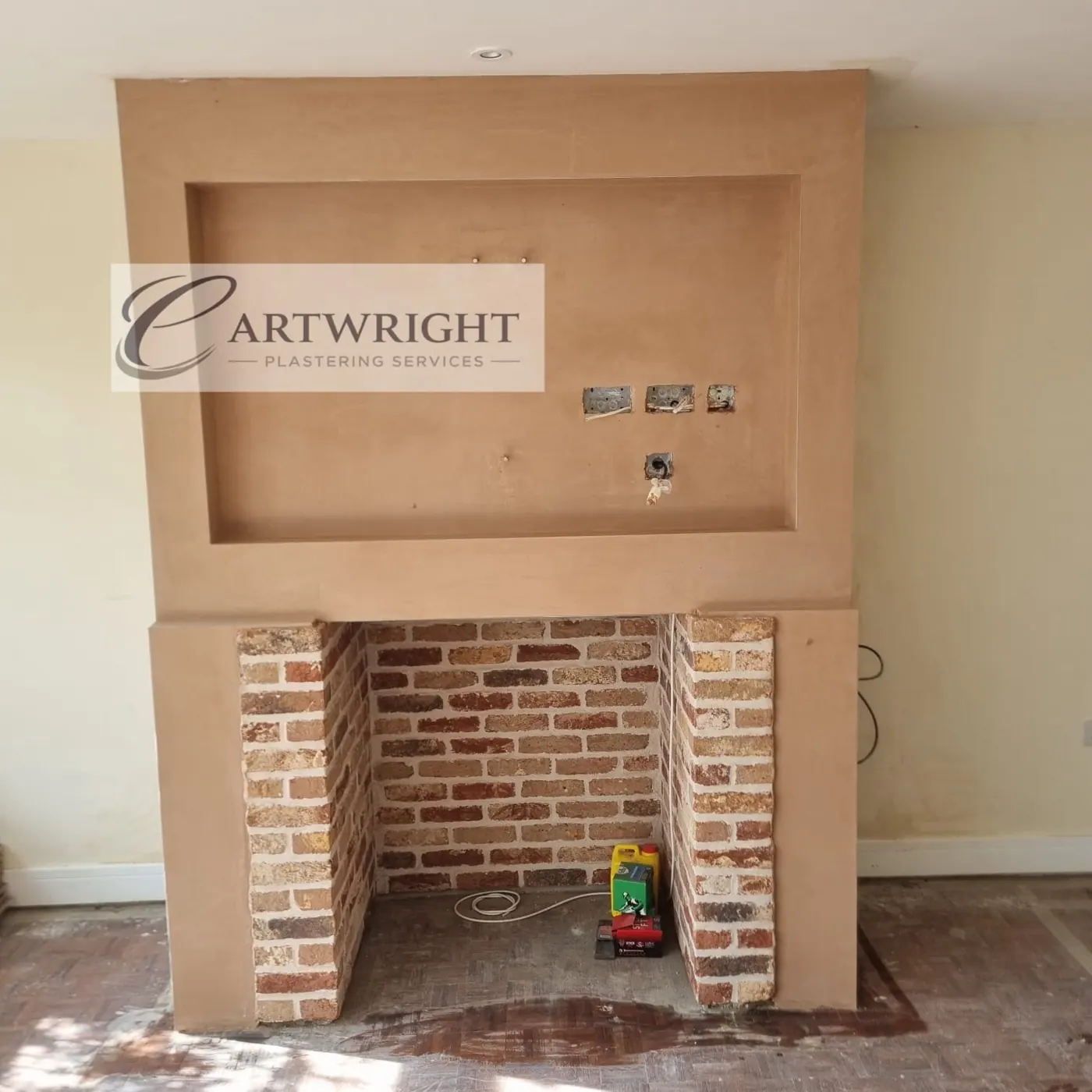 Brick fireplace with new plaster surround and shelf