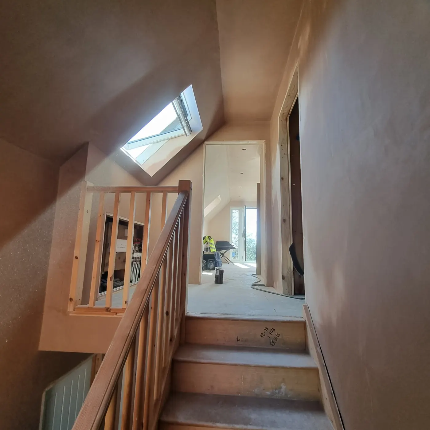 Loft stairwell walls plastered