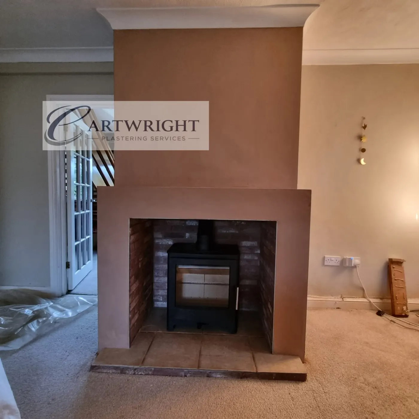 Chimney breast plastered around a log burner